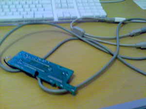 Photo of a circuitboard from a PS/2 keyboard connected to a PS/2-USB adaptor